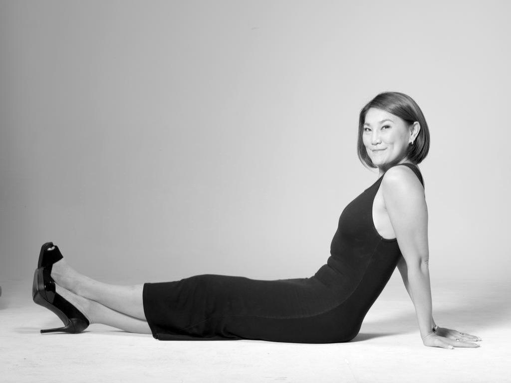 Dr. Loretta Chen seated on a studio floor
